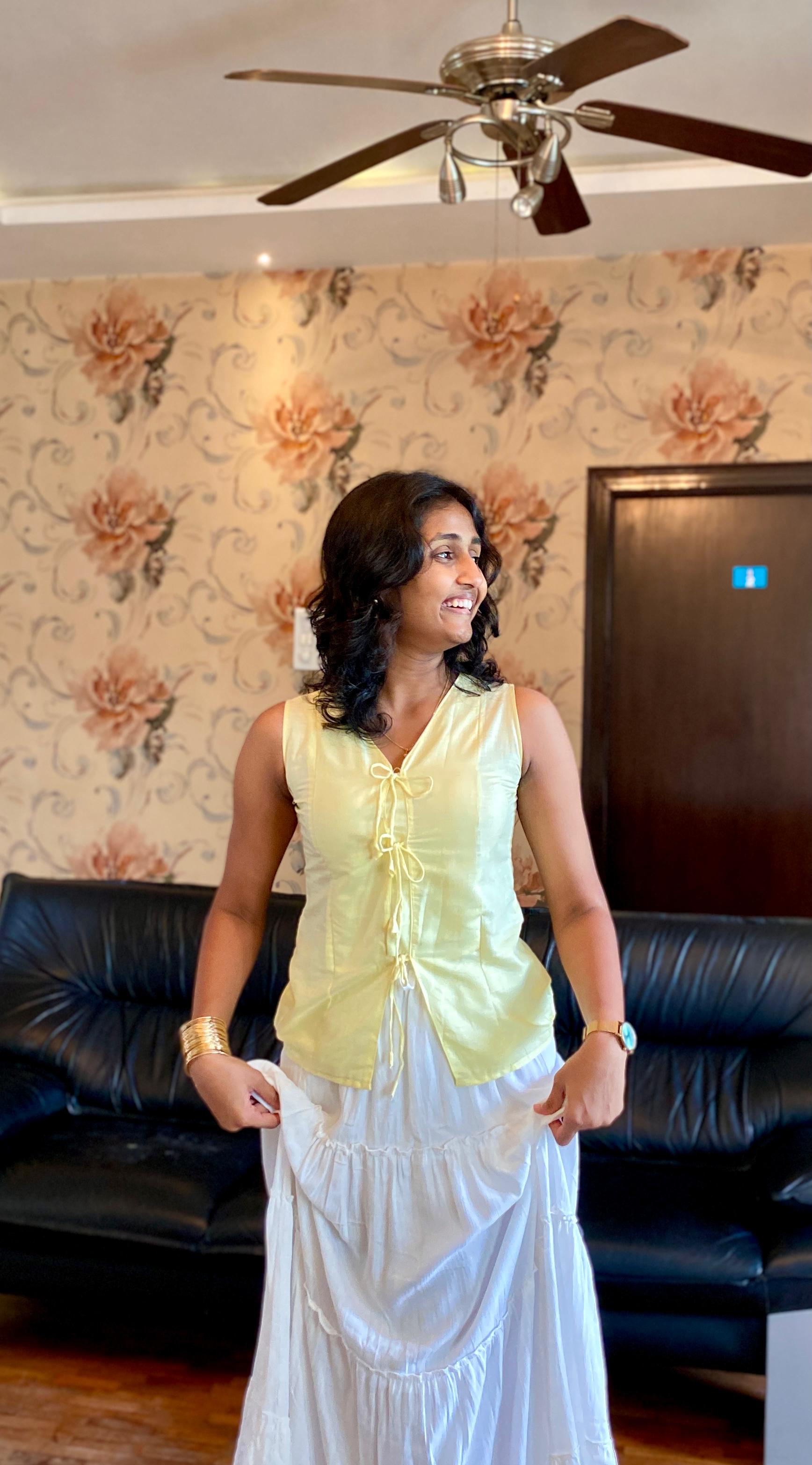Butter Yellow Soft Linen Sleeveless Top with knot Detailed.